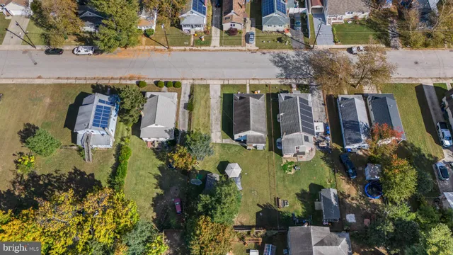 an aerial view of a residential apartment building with a yard