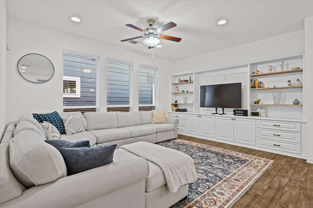 5912 Corrine Lane Austin, TX 78747 - Photo 5 of 27 Living room with custom built in shelving