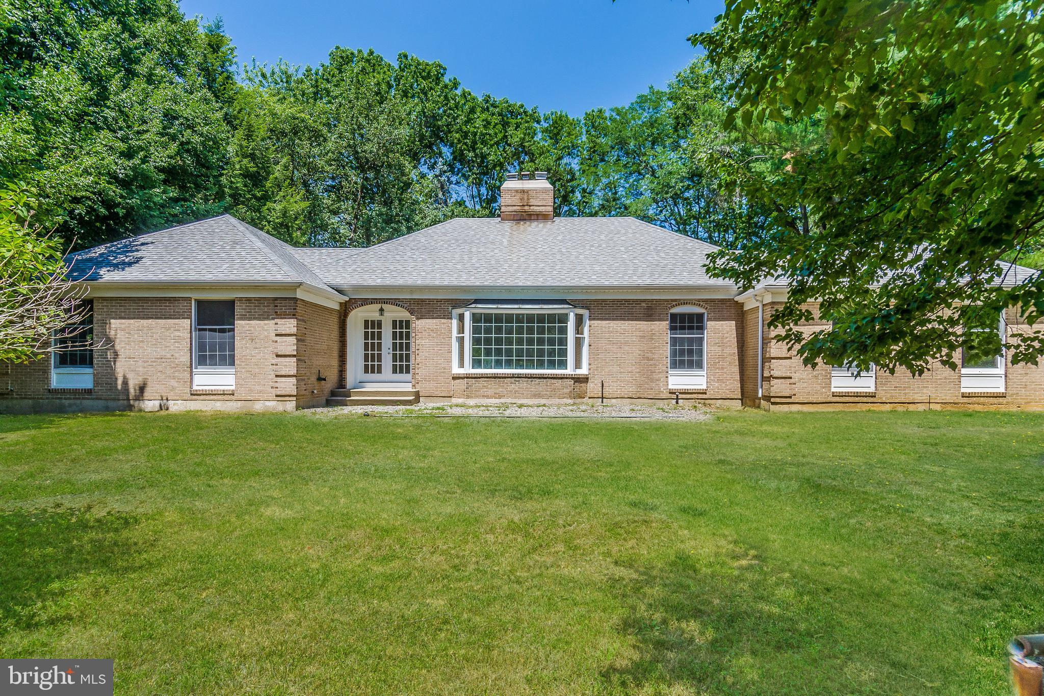 148 Lambertville Hopewell Road Hopewell, NJ 08525 - Photo 1 of 37 a front view of a house with a garden