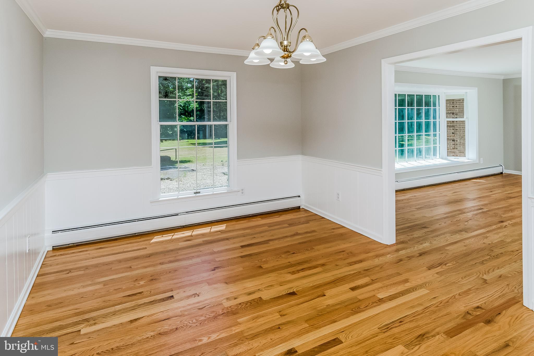 148 Lambertville Hopewell Road Hopewell, NJ 08525 - Photo 12 of 37 a view of empty room with wooden floor and fan