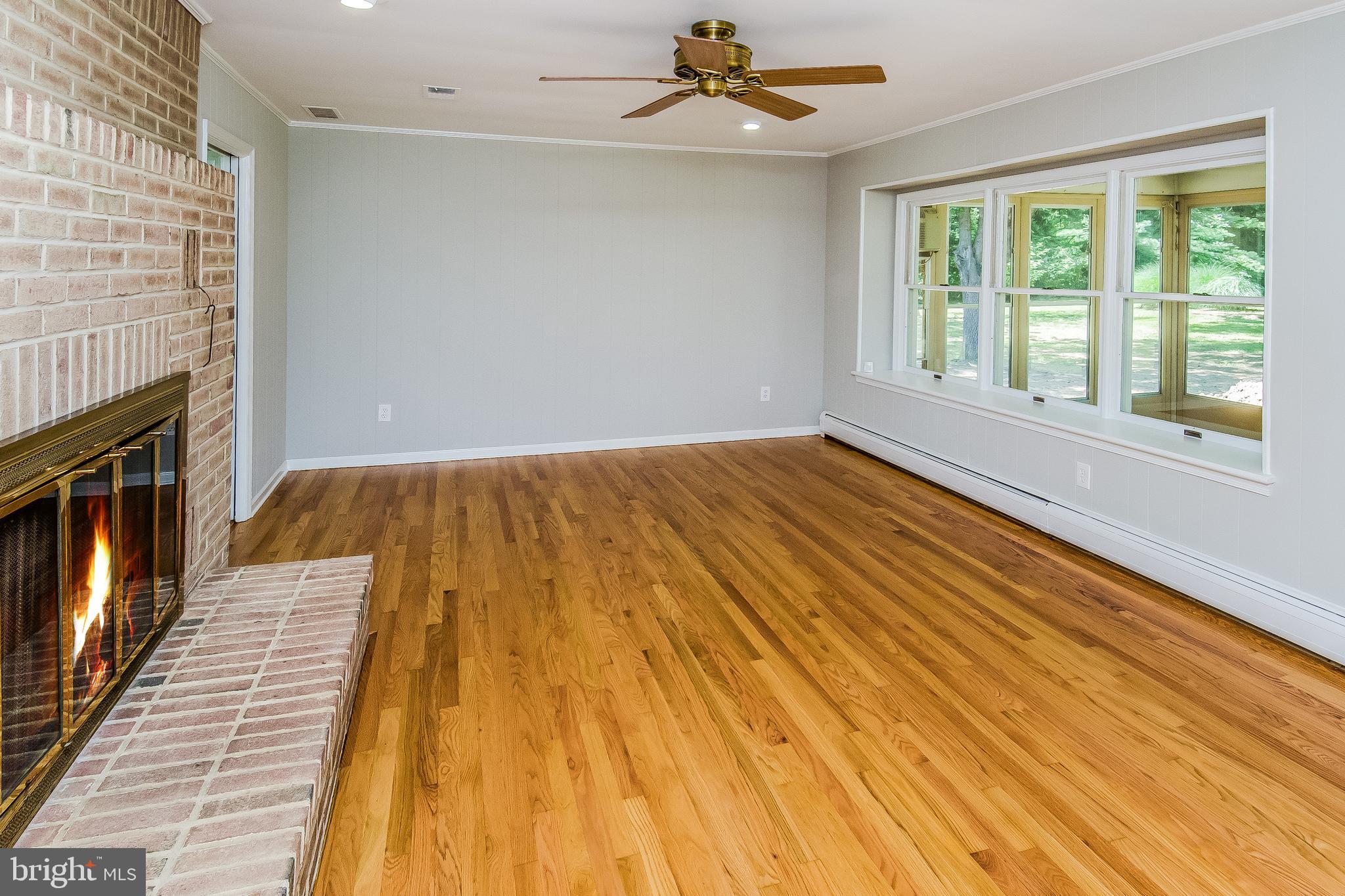 148 Lambertville Hopewell Road Hopewell, NJ 08525 - Photo 16 of 37 a bedroom with a bed and wooden floor