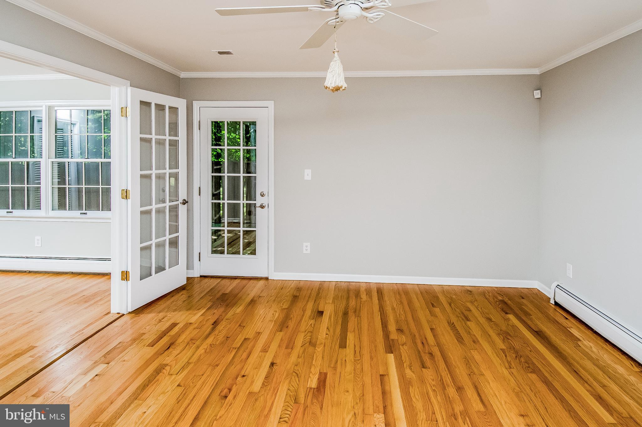 148 Lambertville Hopewell Road Hopewell, NJ 08525 - Photo 19 of 37 a view of empty room with wooden floor and fan