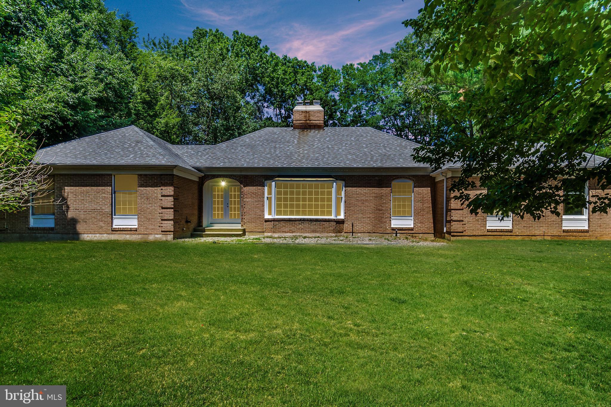 148 Lambertville Hopewell Road Hopewell, NJ 08525 - Photo 2 of 37 a front view of a house with a garden
