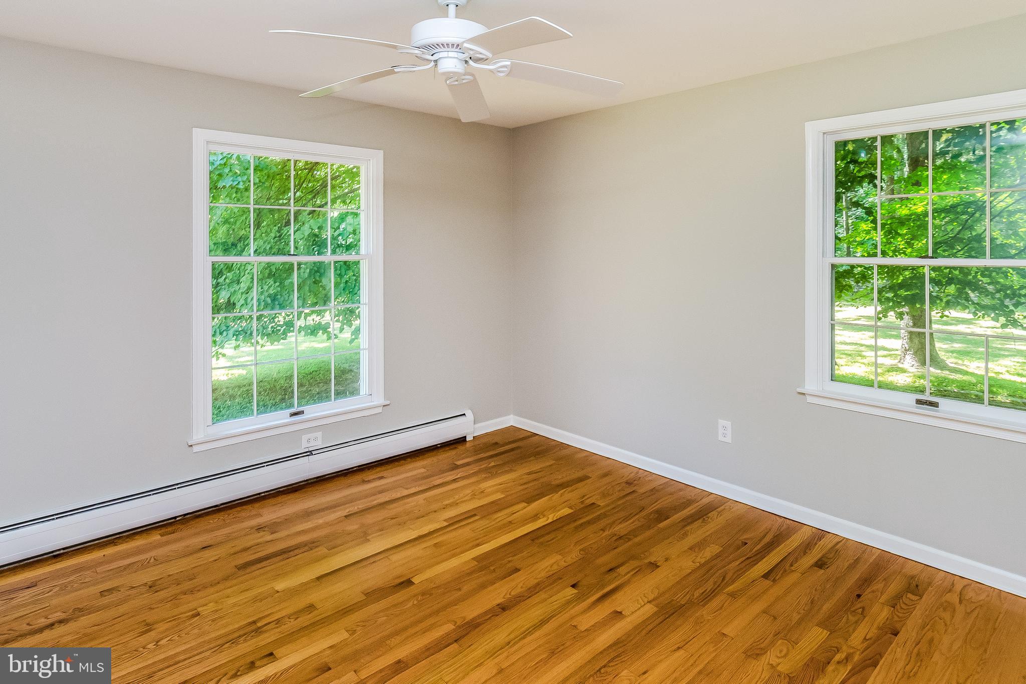 148 Lambertville Hopewell Road Hopewell, NJ 08525 - Photo 25 of 37 a view of an empty room with wooden floor and a window