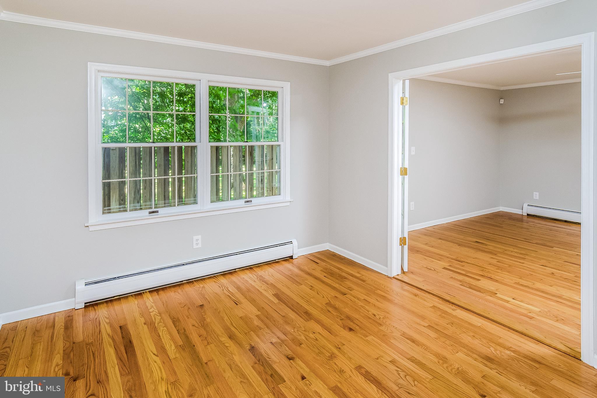 148 Lambertville Hopewell Road Hopewell, NJ 08525 - Photo 27 of 37 a view of an empty room with wooden floor and a window