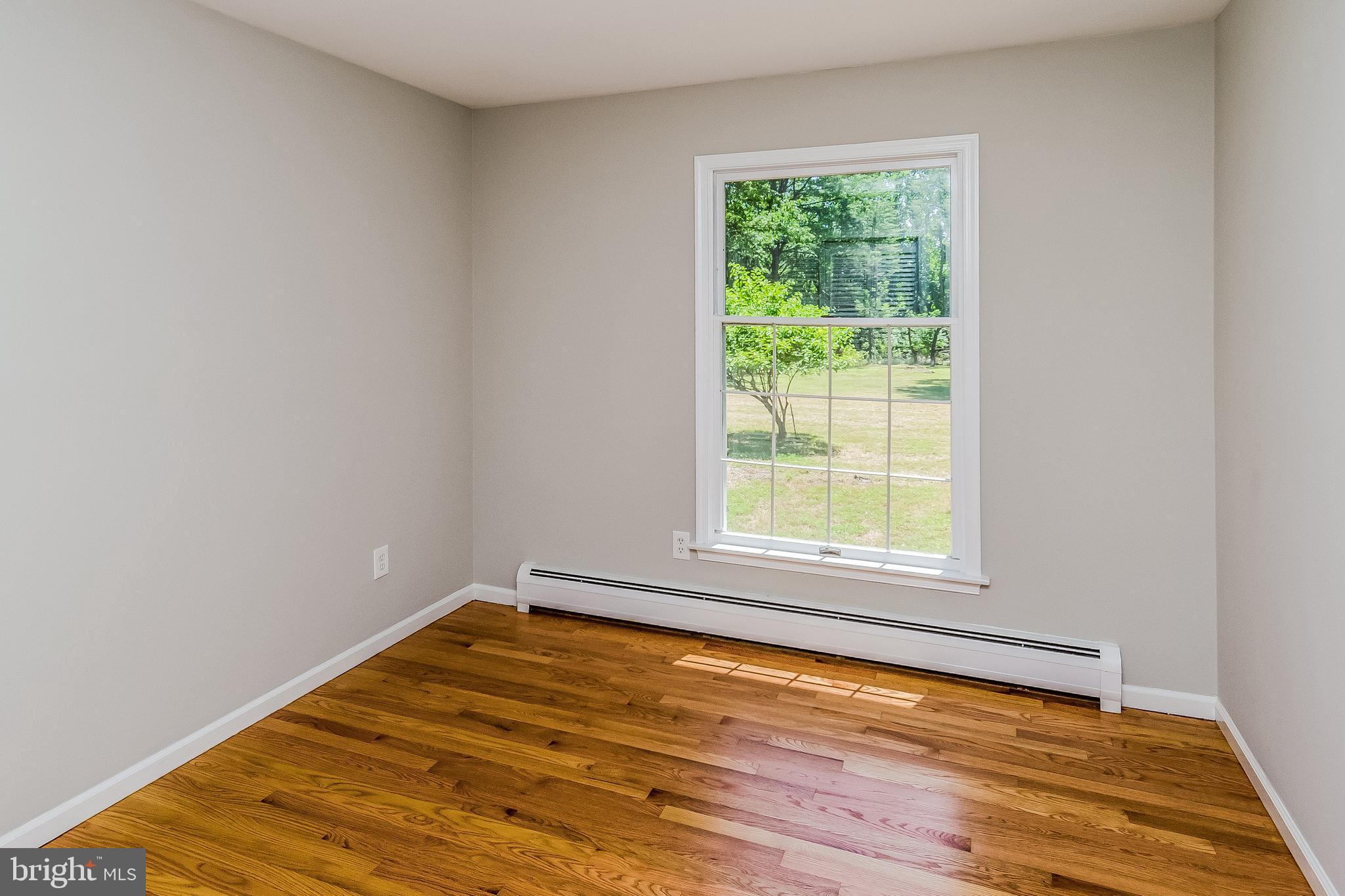 148 Lambertville Hopewell Road Hopewell, NJ 08525 - Photo 29 of 37 a view of empty room with wooden floor and fan