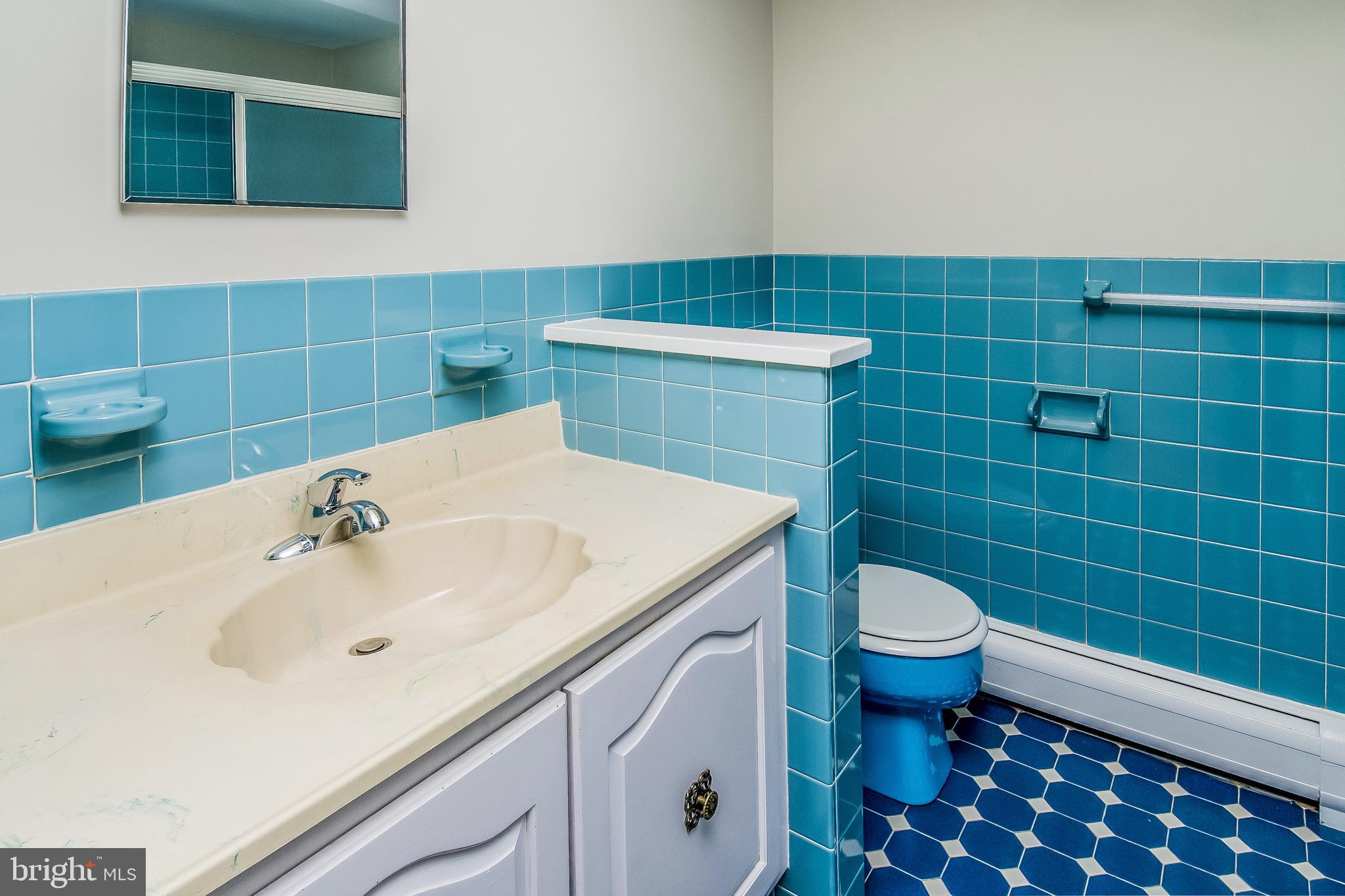 148 Lambertville Hopewell Road Hopewell, NJ 08525 - Photo 30 of 37 a bathroom with a sink a toilet and a mirror