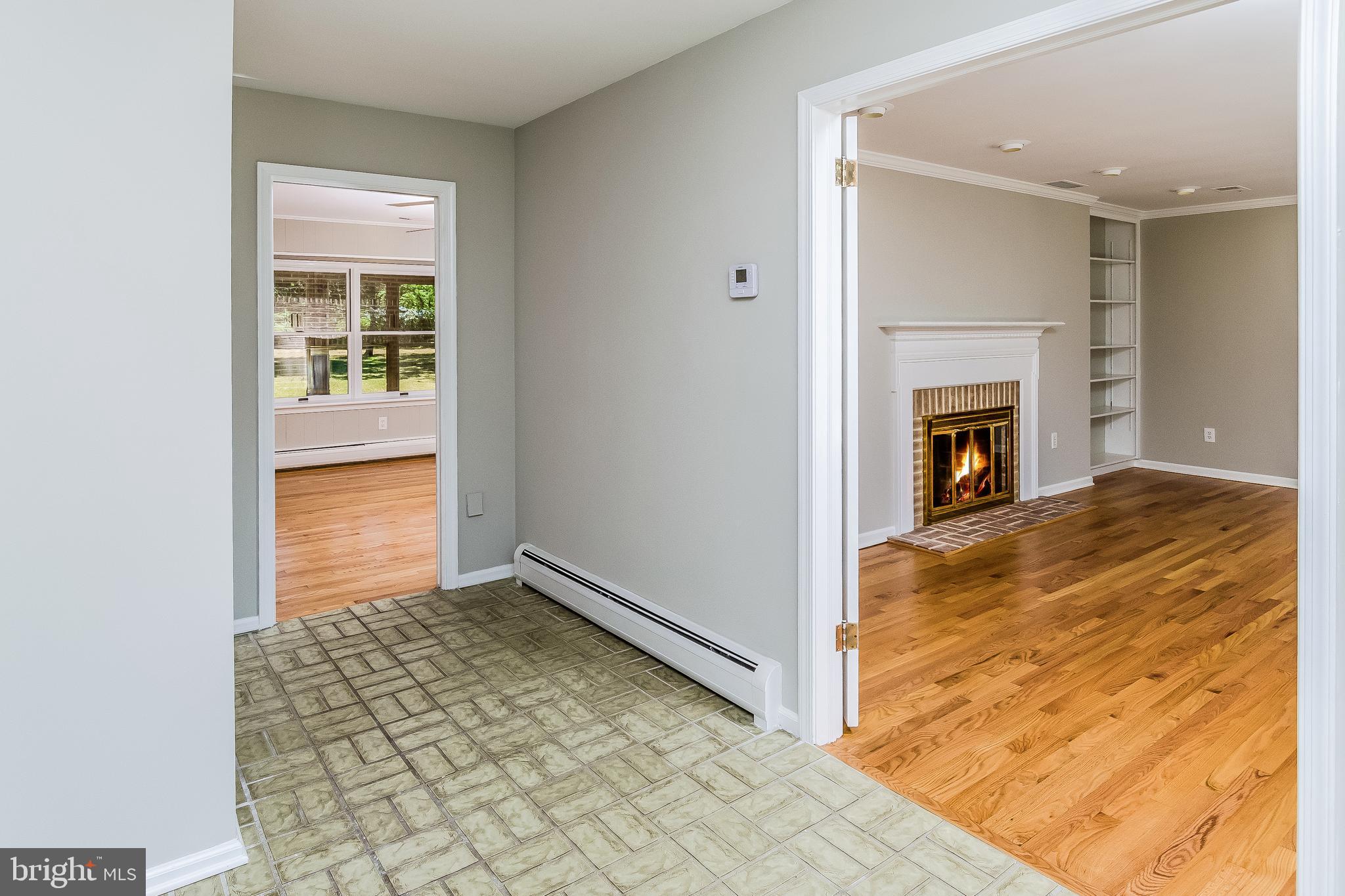 148 Lambertville Hopewell Road Hopewell, NJ 08525 - Photo 7 of 37 a view of a livingroom with wooden floor and a fireplace