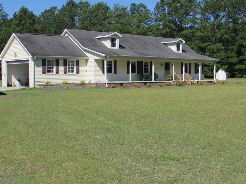 5445 Lineberger Road Lizella, GA 31052 - Photo 1 of 1 a front view of a house with a garden