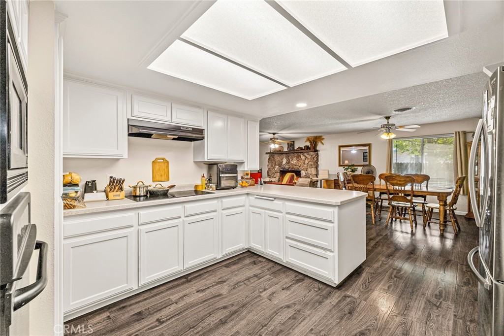 1270 East Eaton Road Chico, CA 95973 - Photo 8 of 9 a kitchen with white cabinets and sink