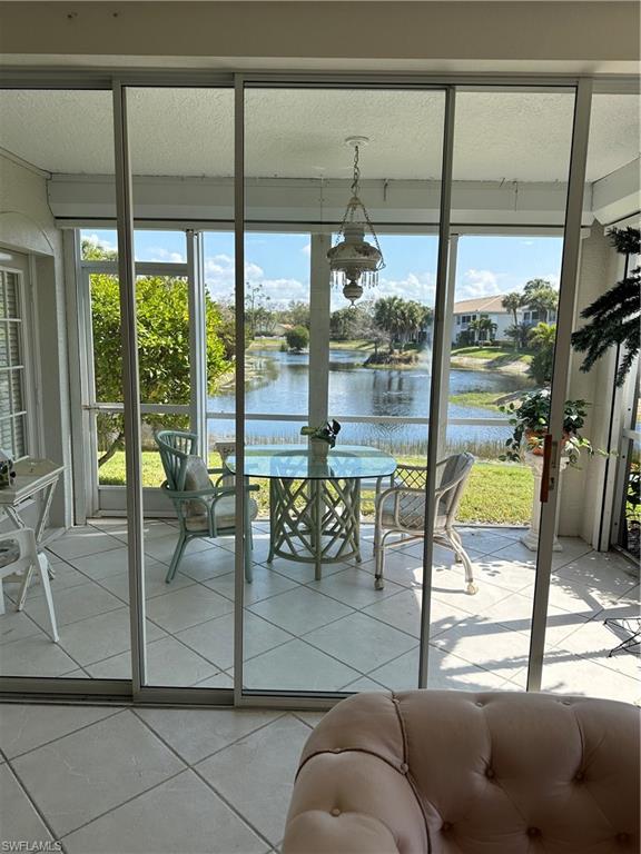 6940 Satinleaf Road North, Unit 104 Naples, FL 34109 - Photo 5 of 20 screened shuttered lanai