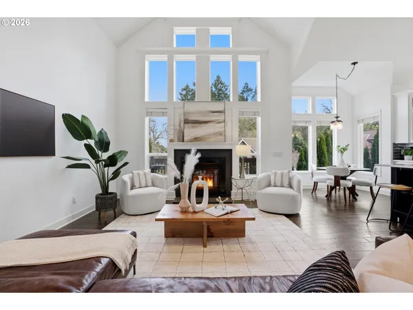 a living room with furniture dining table and a fireplace