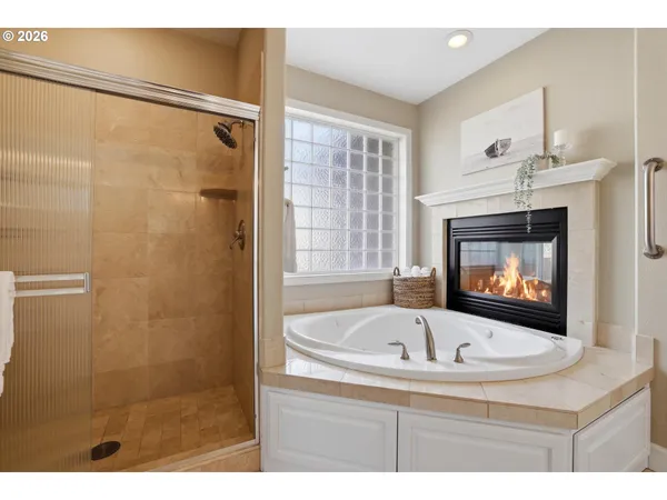 a white bath tub sitting next to a window