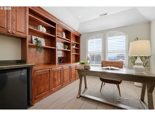 a kitchen with a sink cabinets and window