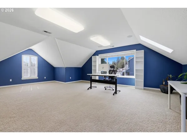 a workspace with furniture and window