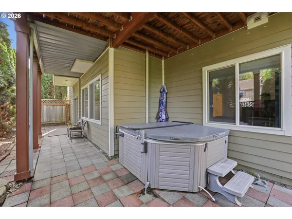 a balcony with a table and chairs