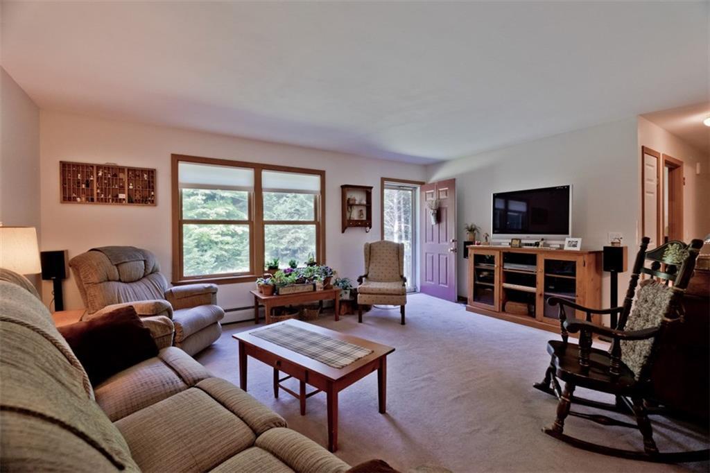 55 Woodland Road Durham, ME 04222 - Photo 12 of 29 The Living Room is spacious, with...