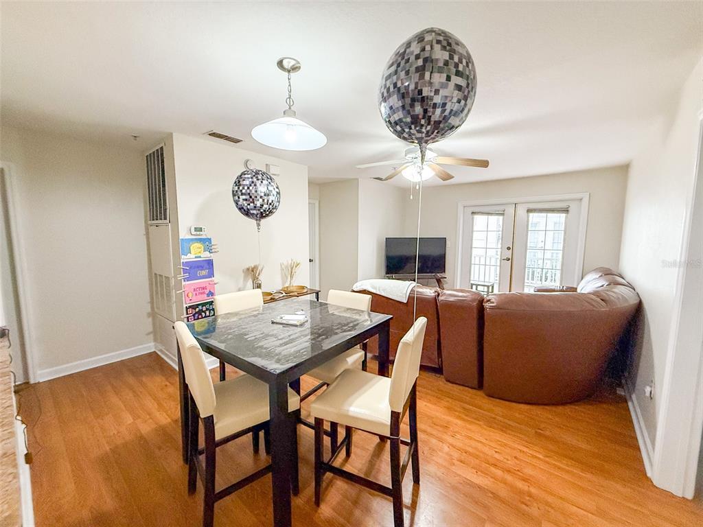 835 Southwest 9th Street, Unit 108 Gainesville, FL 32601 - Photo 5 of 9 a view of a dining room with furniture and window