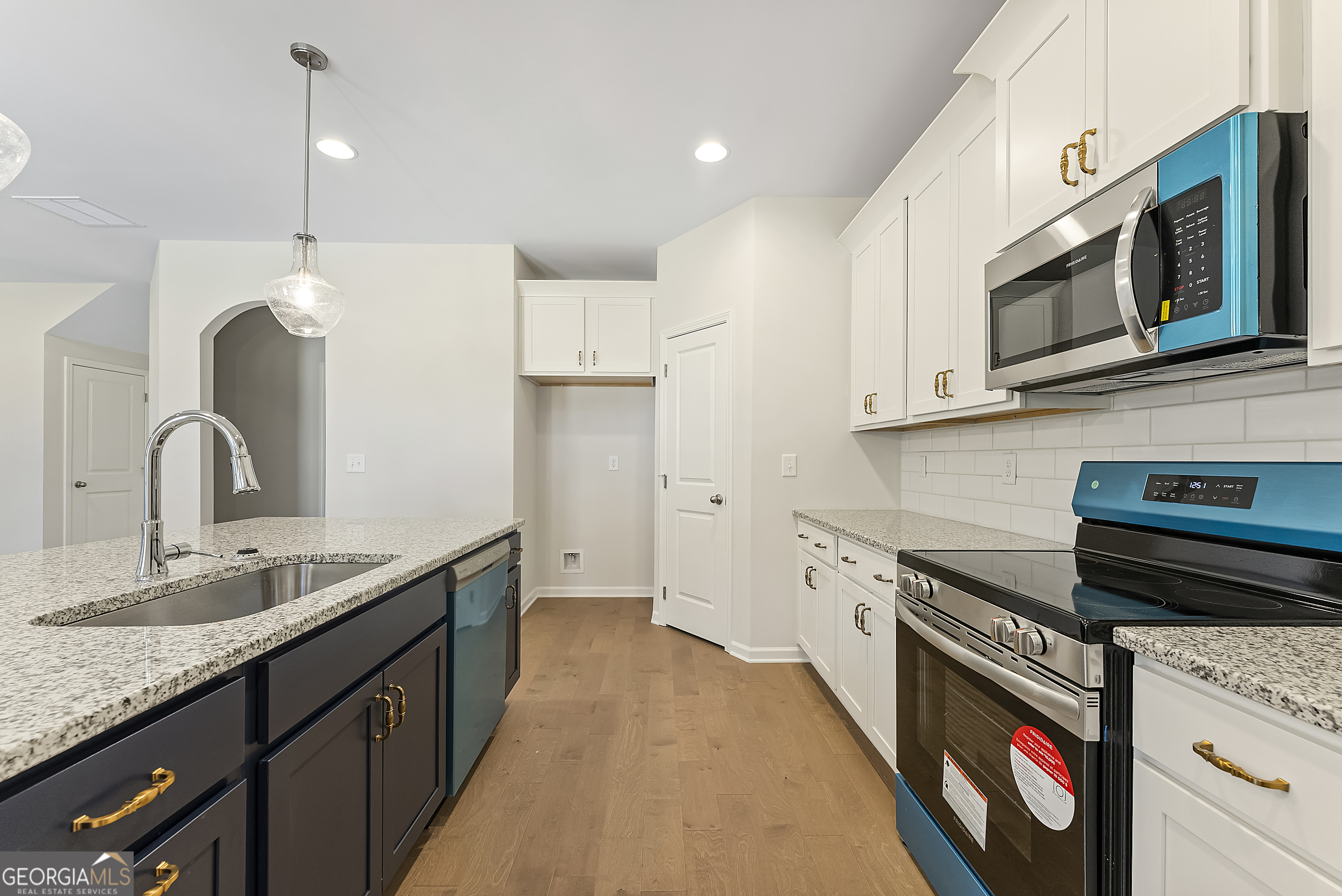 515 Bohannon Road, Unit 13 Grantville, GA 30220 - Photo 12 of 40 a kitchen with stainless steel appliances granite countertop a sink and a stove