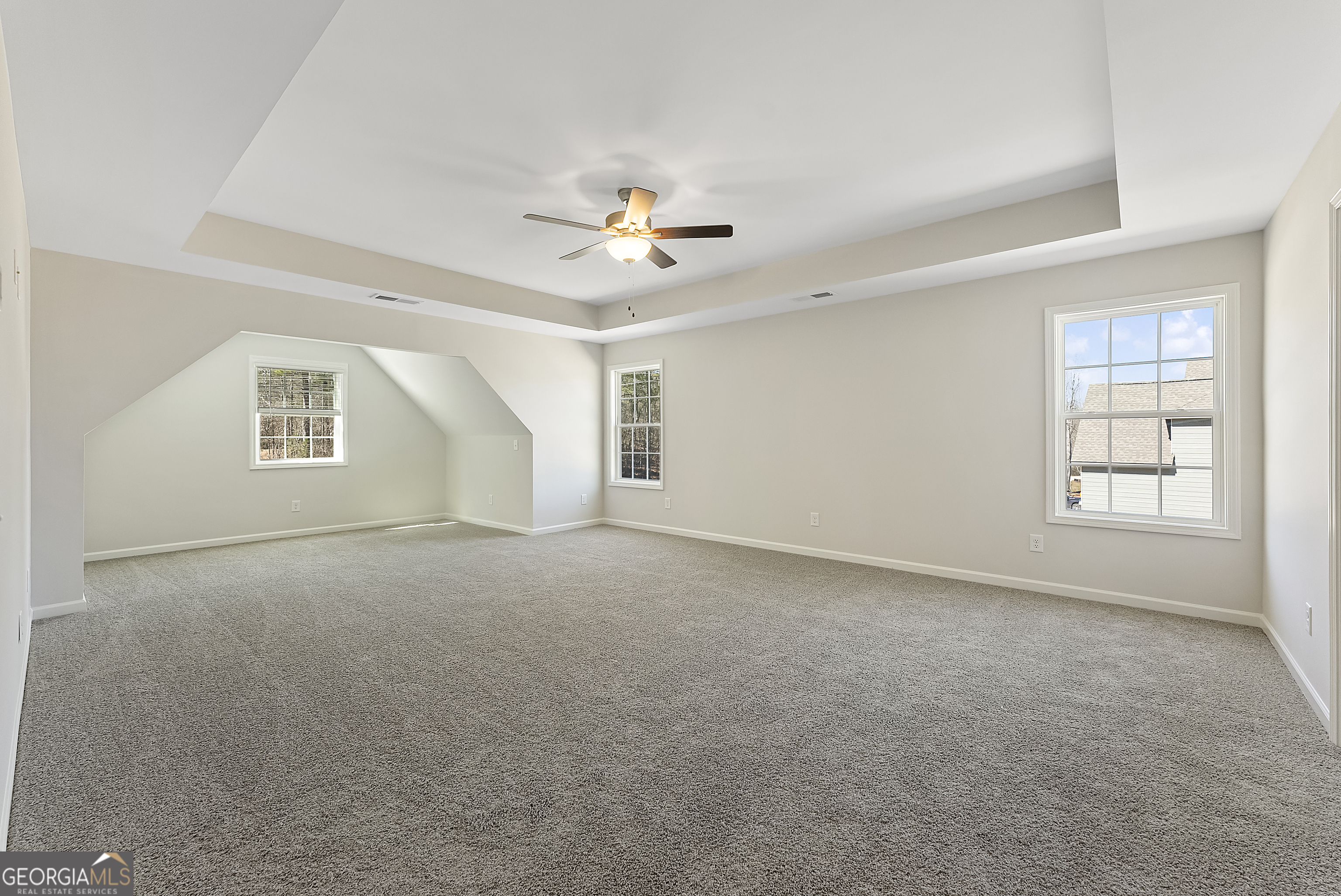 515 Bohannon Road, Unit 13 Grantville, GA 30220 - Photo 22 of 40 an empty room with windows and ceiling fan