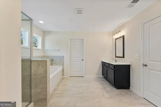 a view of a kitchen cabinets and refrigerator