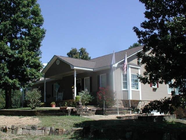 541 Carpenter Road Northeast Calhoun, GA 30701 - Photo 1 of 1 a front view of a house with garden
