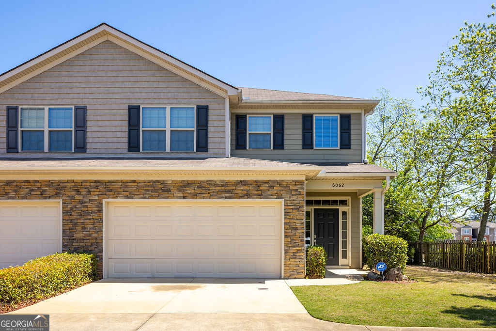 6062 Townes Way Columbus, GA 31909 - Photo 1 of 1 a front view of a house with garden
