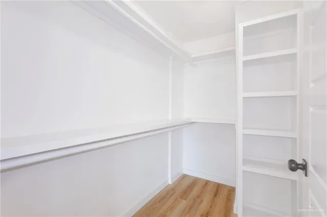 a view of an empty walk in closet