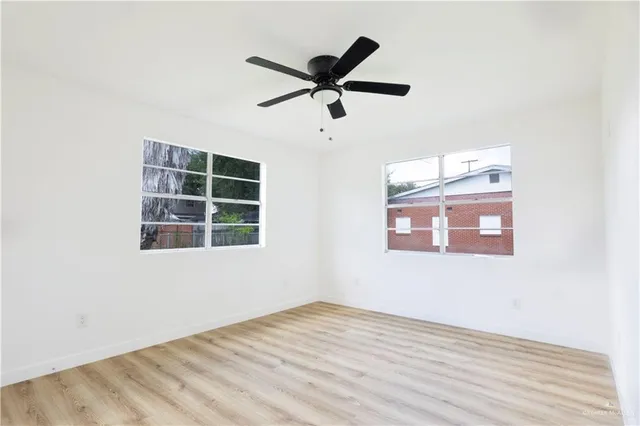 a view of an empty room with a window