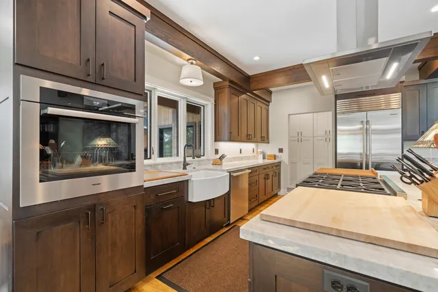 a bathroom with double vanity sinks and a mirror