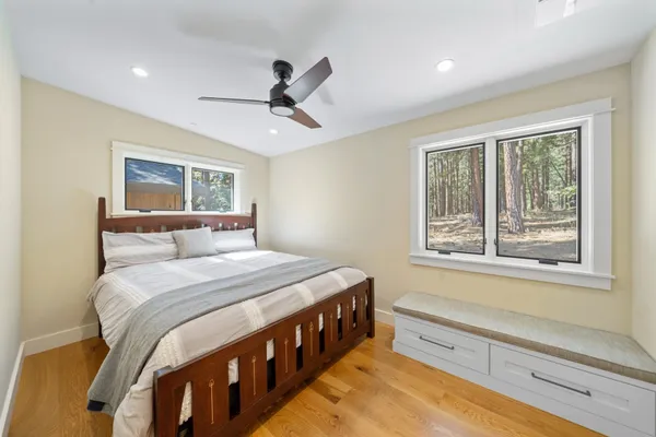 a view of a livingroom with furniture window and wooden floor