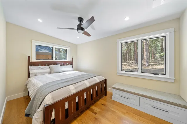 a view of a livingroom with furniture window and wooden floor