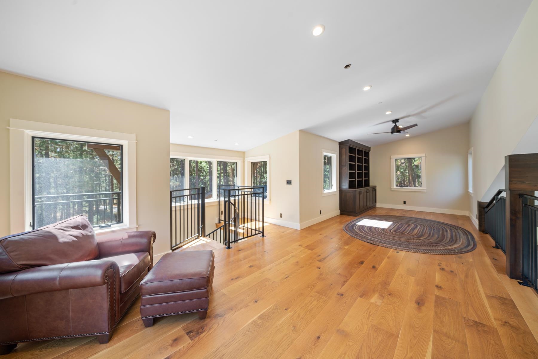 5720 Money Road Beckwourth, CA 96129 - Photo 23 of 28 a spacious bedroom with a bed a couch and a large window