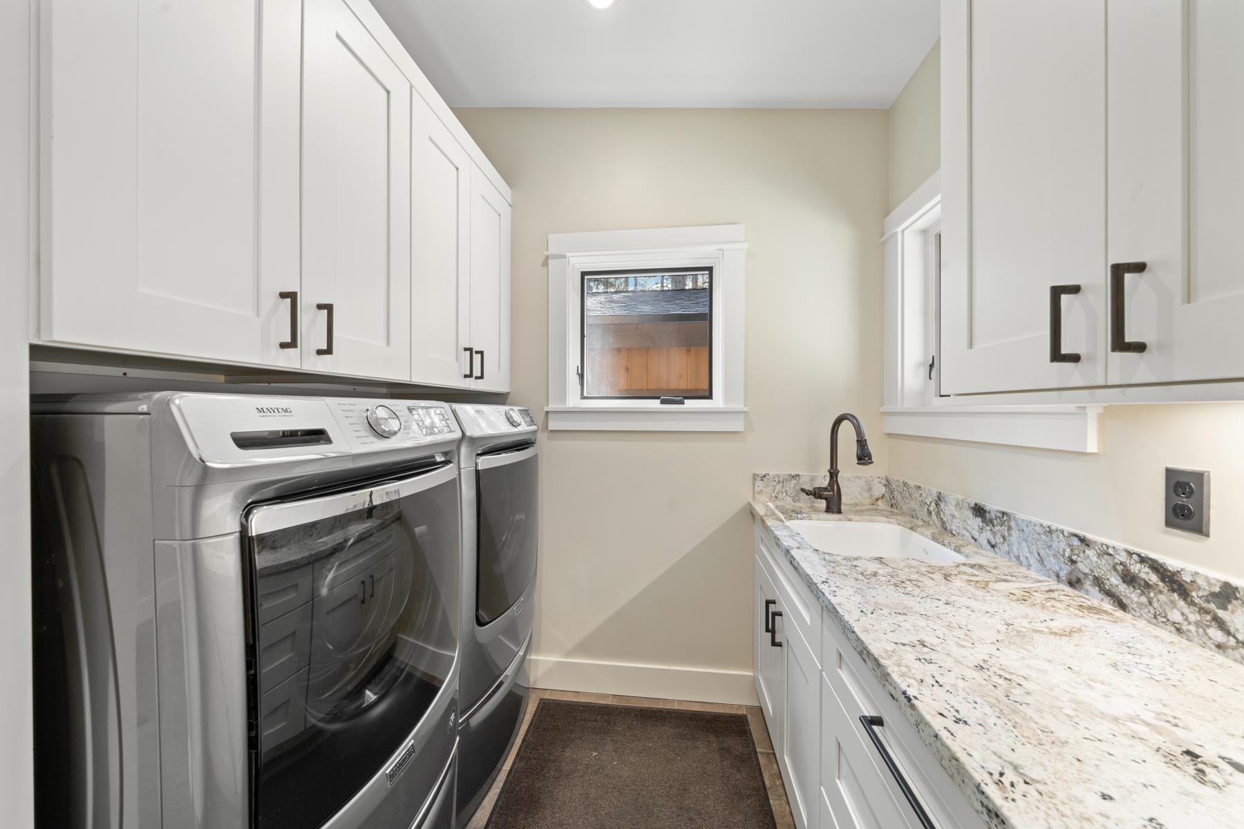 5720 Money Road Beckwourth, CA 96129 - Photo 24 of 28 a kitchen with granite countertop a sink a stove and cabinets