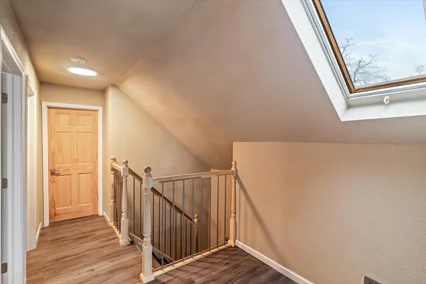 a view of a hallway with staircase