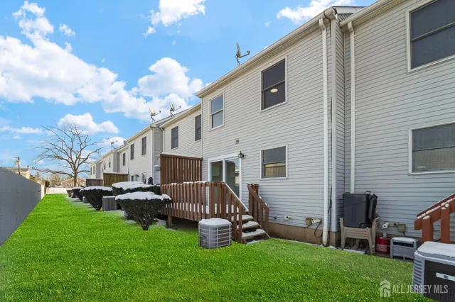 a front view of house with yard and outdoor seating