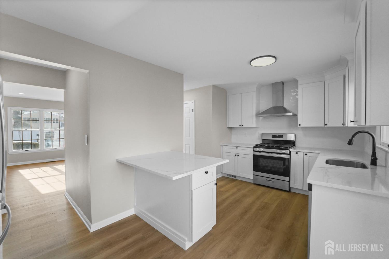 85 Wilton Avenue Middlesex, NJ 08846 - Photo 7 of 25 a kitchen with stainless steel appliances a sink stove and cabinets