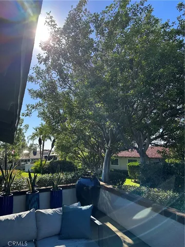 a view of patio with couches and a fire pit