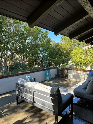a view of a outdoor sitting area with furniture