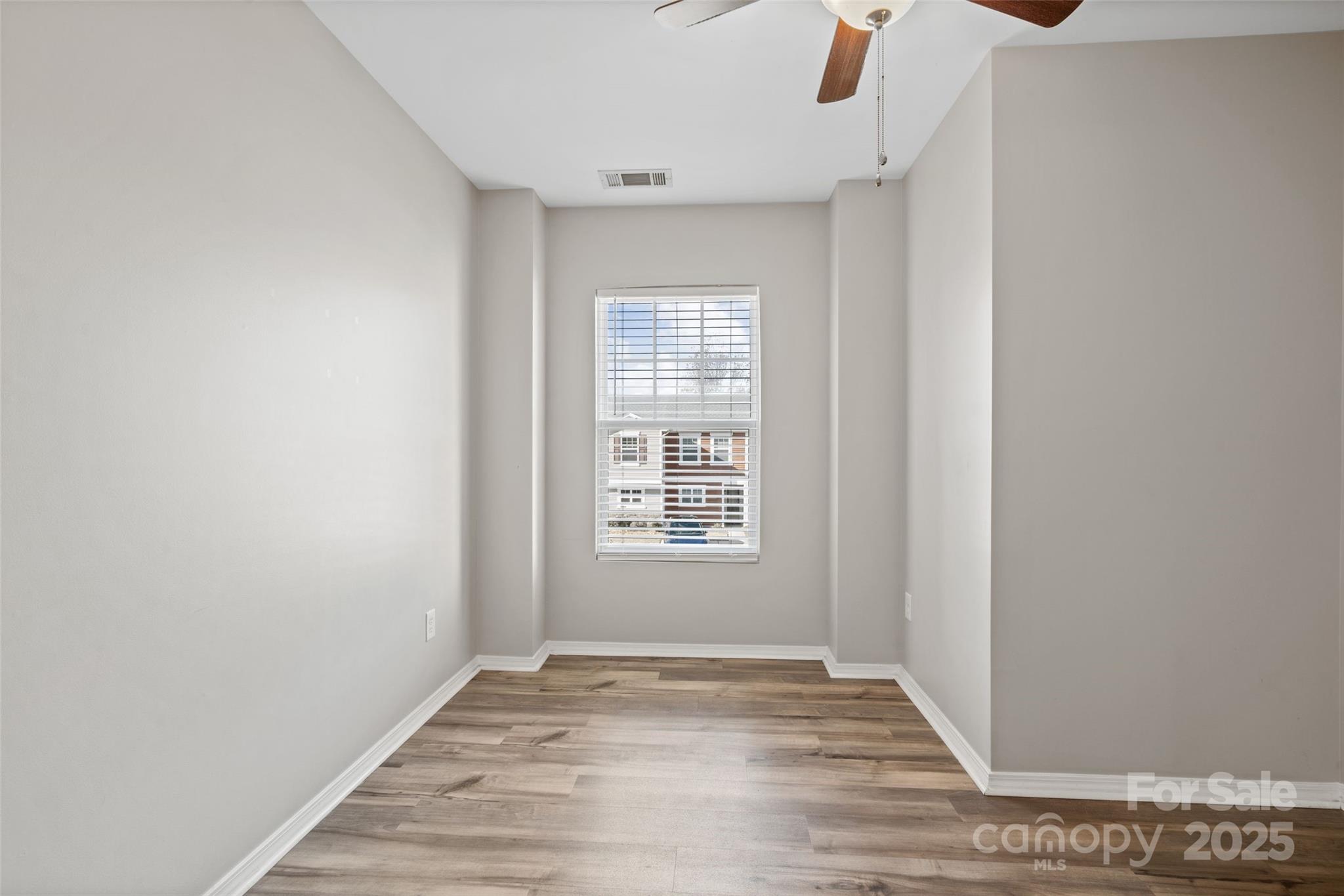 325 River Clay Road Fort Mill, SC 29708 - Photo 7 of 15 a view of an empty room with wooden floor and a window