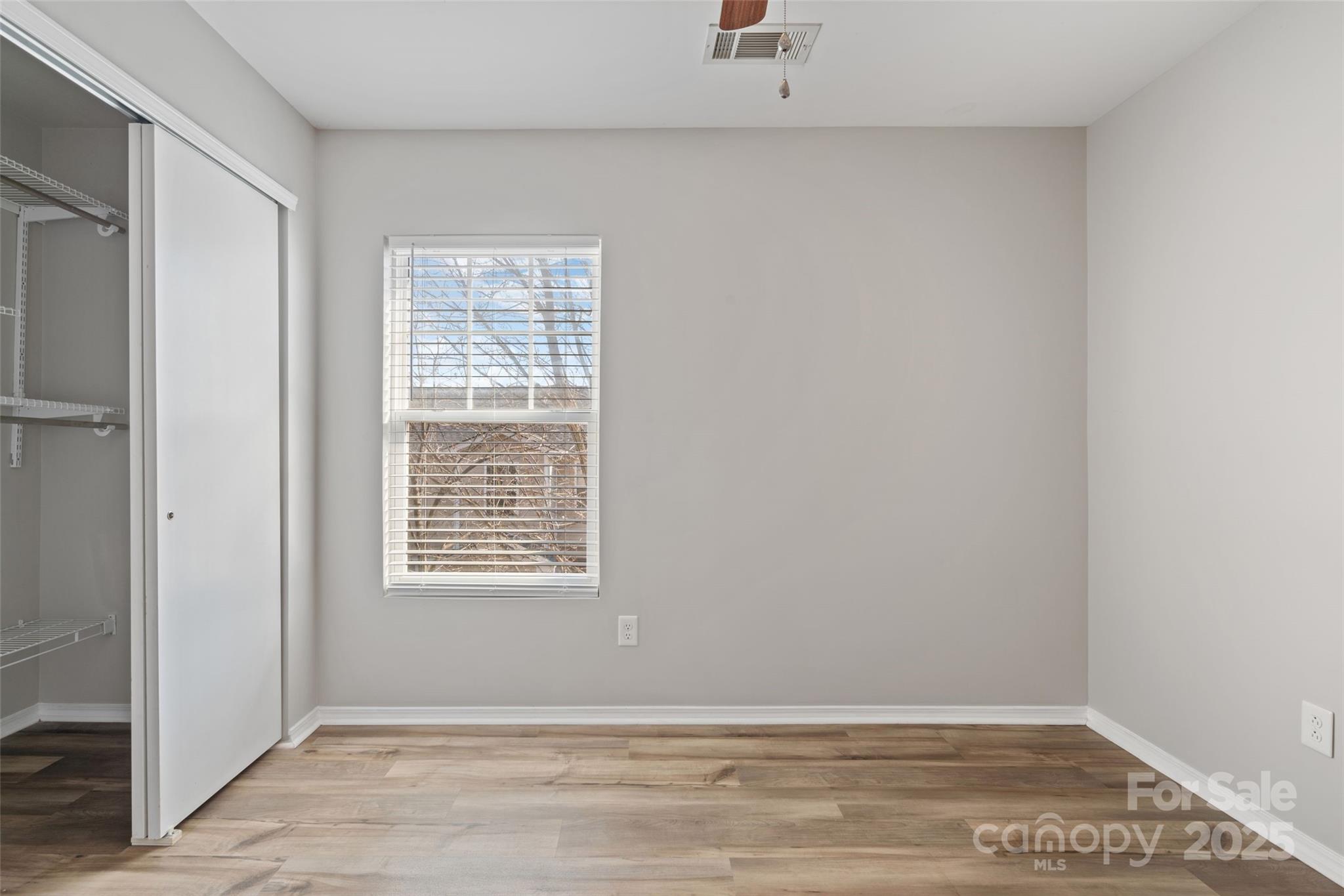 325 River Clay Road Fort Mill, SC 29708 - Photo 9 of 15 a view of an empty room with wooden floor and a window