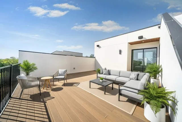 a view of a room with wooden floor