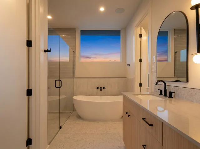a bathroom with a double vanity sink a mirror and a bathtub