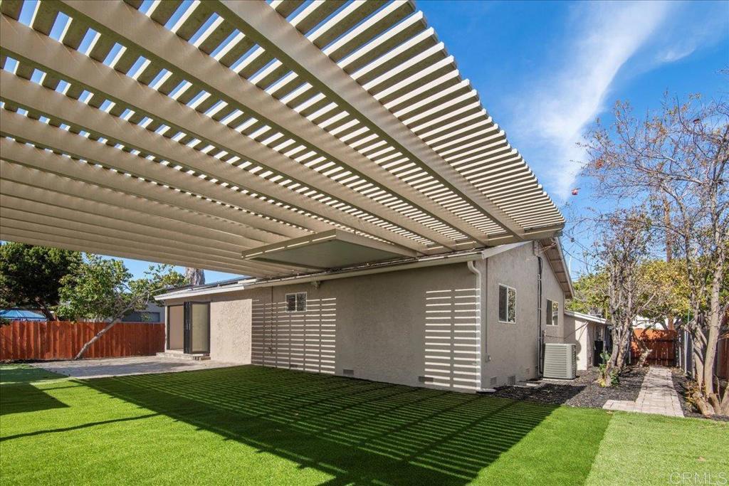 8739 St George Street Spring Valley, CA 91977 - Photo 14 of 30 a view of a house with a yard