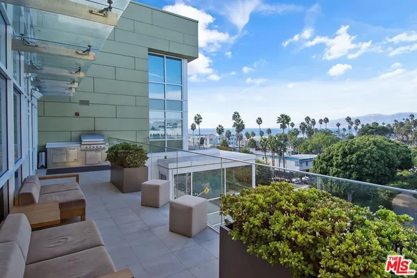 a view of a terrace with sitting area