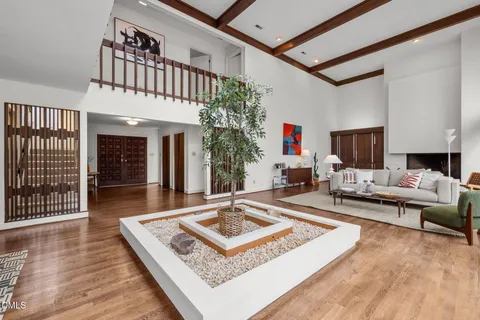 a living room with furniture and a rug