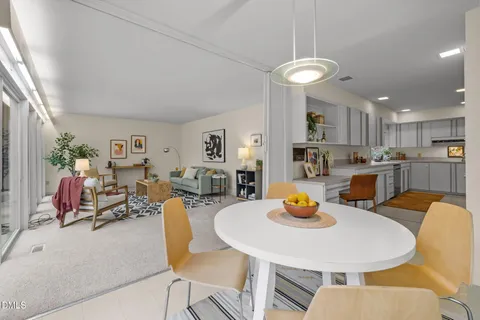 a kitchen with a refrigerator and a stove