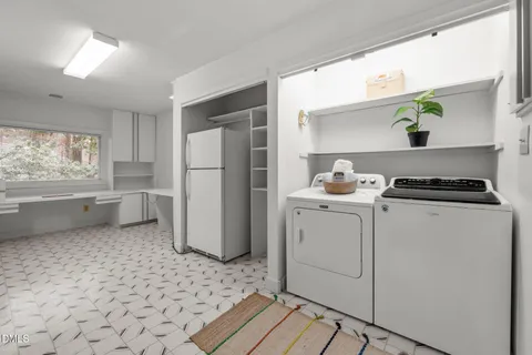 a bathroom with a sink double vanity and a mirror