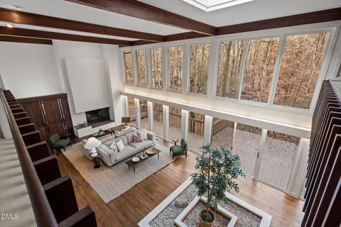 a bathroom with a granite countertop sink a toilet and a mirror