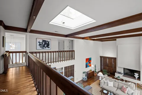 a bathroom with a granite countertop sink a mirror and a bathtub